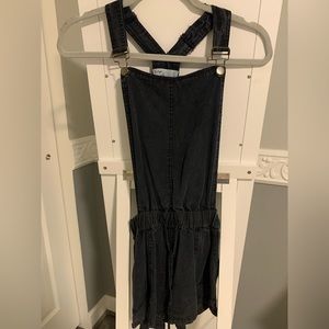 black overalls with red and white stripe